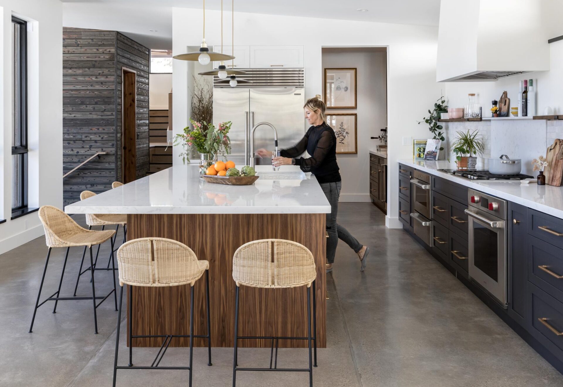 Columbia Cabinets | Home | custom cabinetry designed for life | view 1 | Woman in stylish kitchen