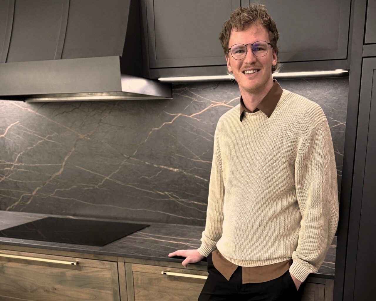join our team | craft your career | Jordan Schmidt standing in a Columbia Cabinets Kitchen