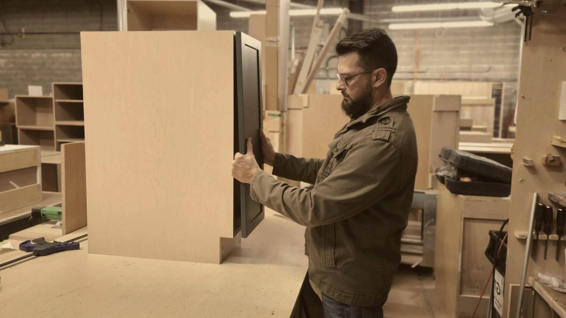 join our team | craft your career | Man working on manufacturing cabinets